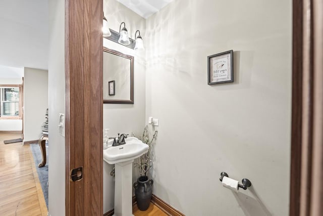 bathroom with sink and wood-type flooring