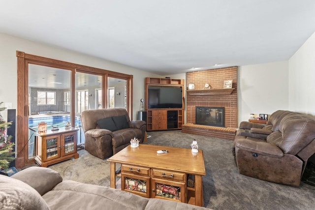 carpeted living room with a brick fireplace