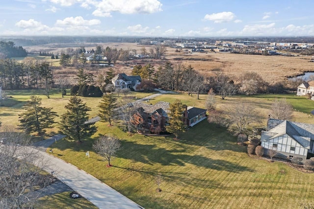 birds eye view of property with a rural view