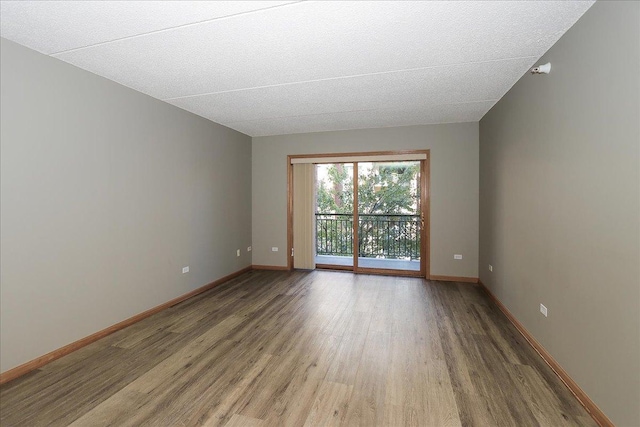 spare room featuring hardwood / wood-style floors