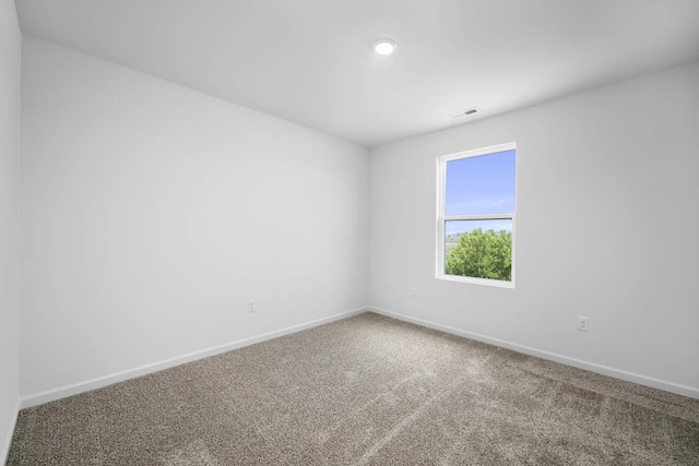 spare room featuring carpet