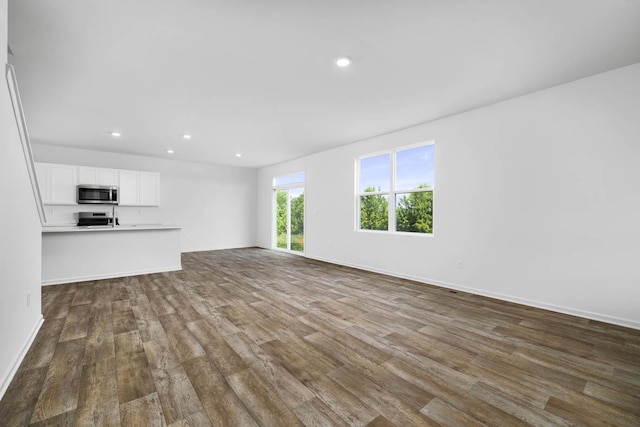 unfurnished living room with hardwood / wood-style floors