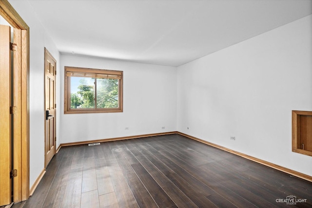 empty room featuring dark hardwood / wood-style floors