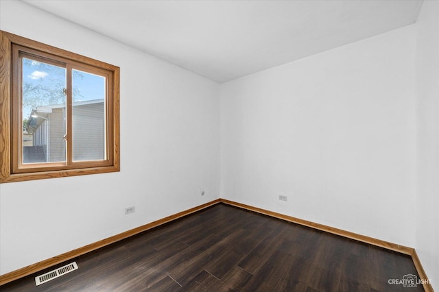 unfurnished room with hardwood / wood-style floors