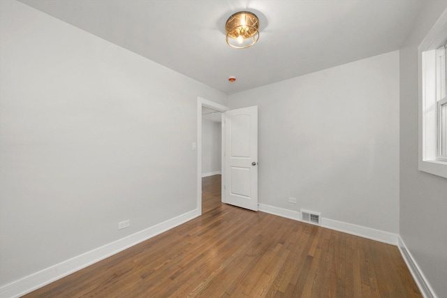 empty room featuring wood-type flooring