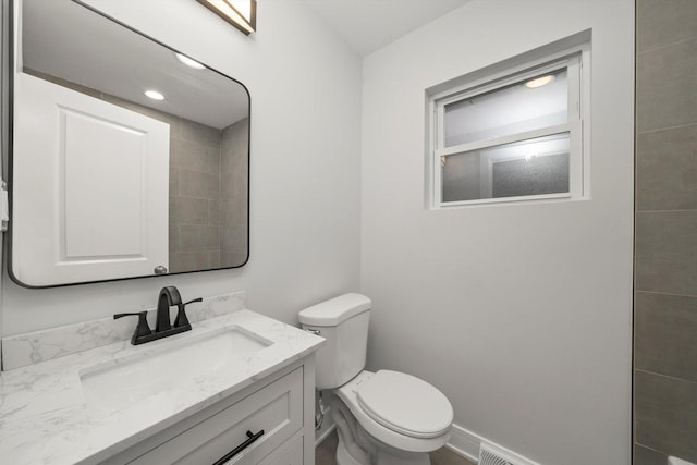 bathroom with vanity and toilet