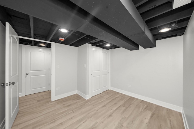 basement featuring light hardwood / wood-style flooring