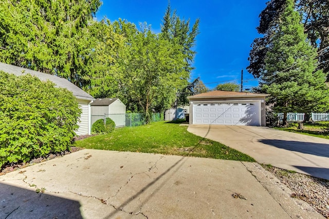 exterior space featuring an outbuilding, a garage, and a front lawn