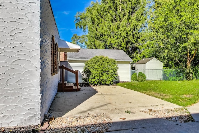 view of home's exterior with a lawn and a patio