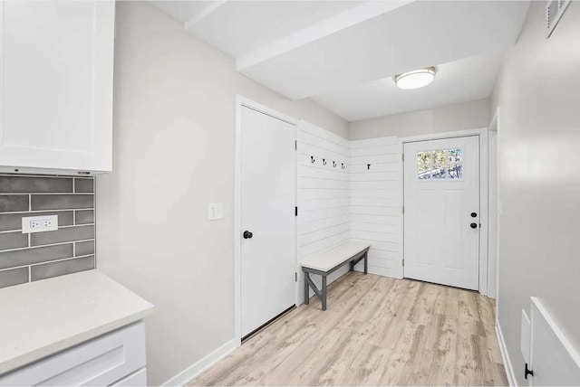 mudroom with light hardwood / wood-style floors