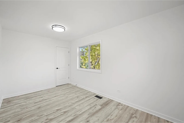 unfurnished room featuring light wood-type flooring