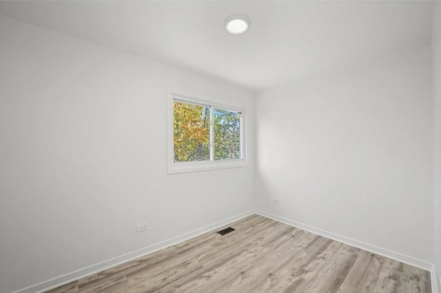 unfurnished room featuring light hardwood / wood-style flooring