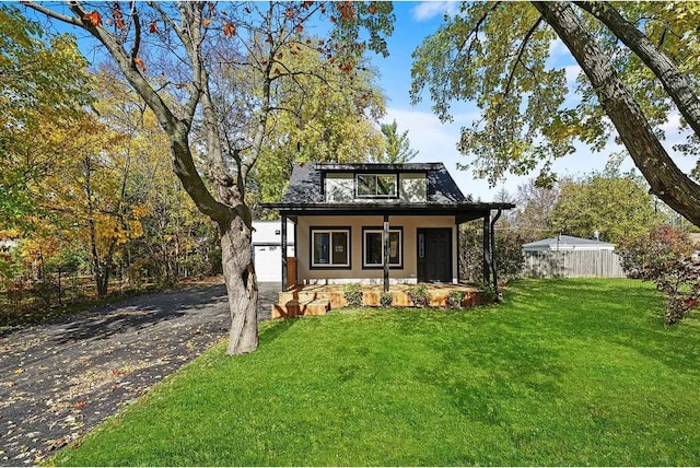 view of front of house featuring a porch and a front lawn