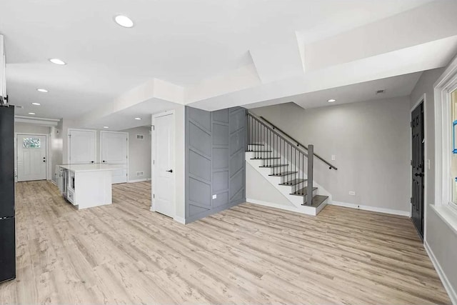 unfurnished living room with light hardwood / wood-style floors