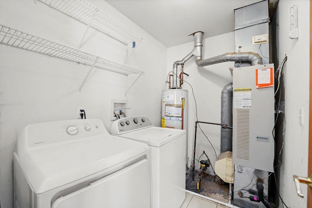 laundry area with washer and clothes dryer, gas water heater, and light tile patterned floors