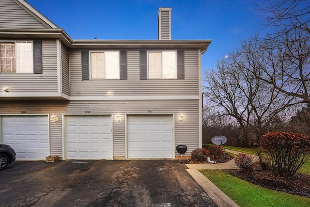 exterior space with a garage