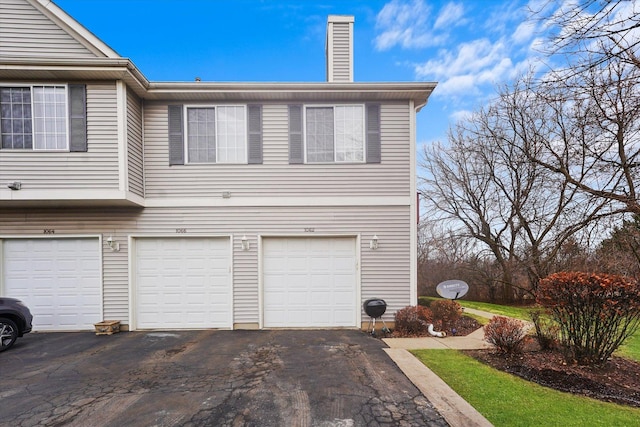 exterior space with a garage