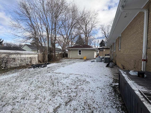 view of yard layered in snow