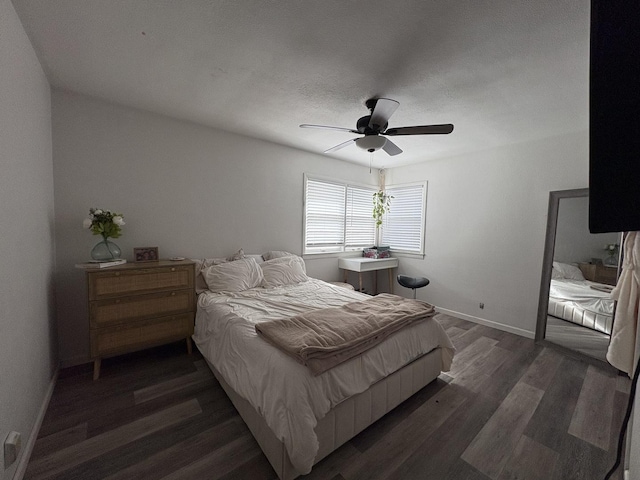 bedroom featuring ceiling fan and dark hardwood / wood-style floors