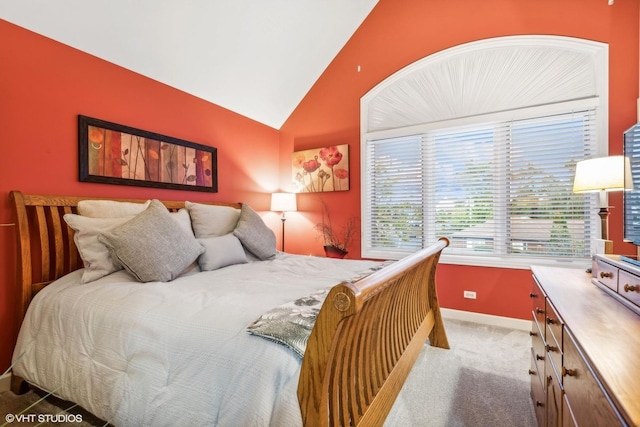 carpeted bedroom featuring vaulted ceiling