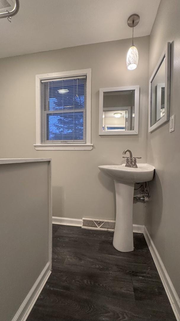 bathroom featuring wood-type flooring