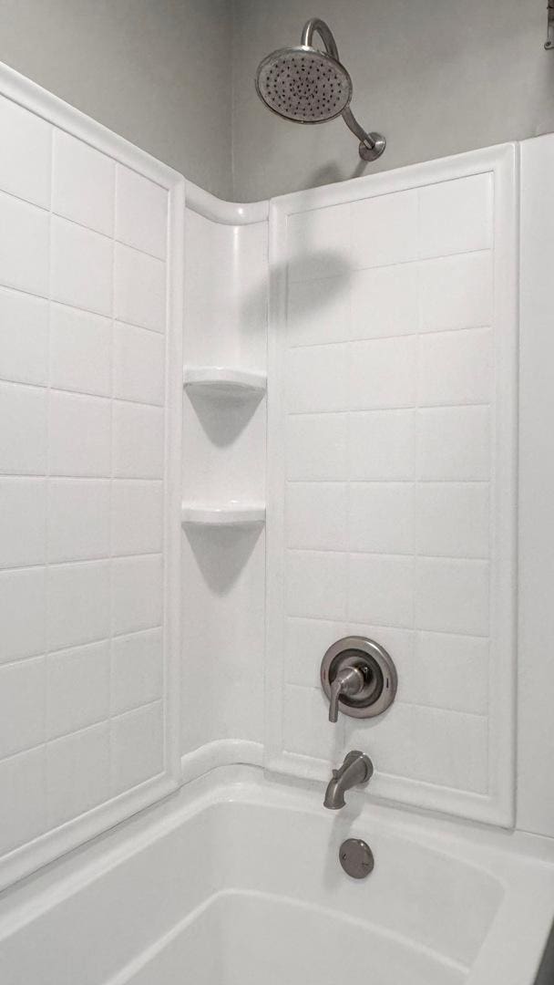 bathroom with shower / bathtub combination