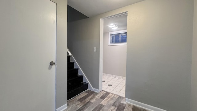 stairs with wood-type flooring