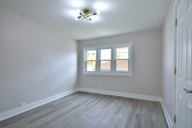 unfurnished room with light hardwood / wood-style flooring