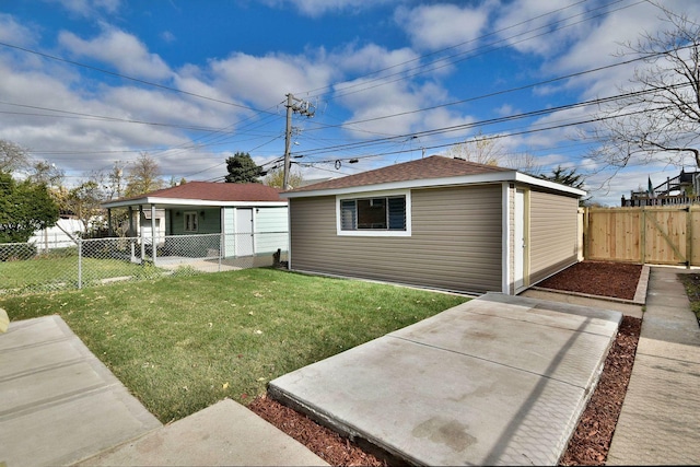 rear view of property with a lawn