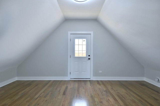 bonus room featuring dark hardwood / wood-style flooring and lofted ceiling