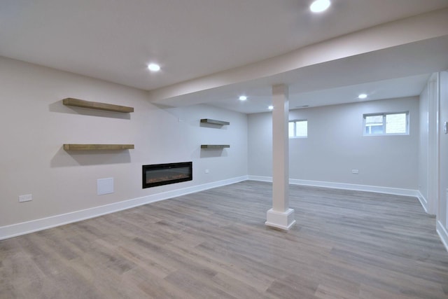 basement featuring hardwood / wood-style floors