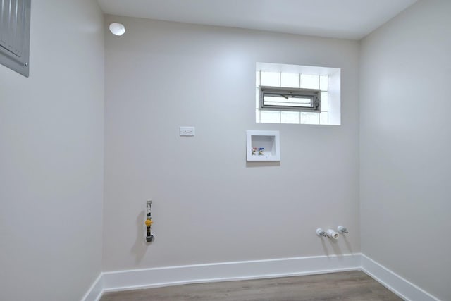 clothes washing area featuring hookup for a washing machine, hookup for a gas dryer, and wood-type flooring