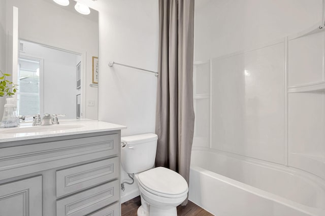 full bathroom featuring wood-type flooring, vanity, toilet, and shower / bath combo with shower curtain