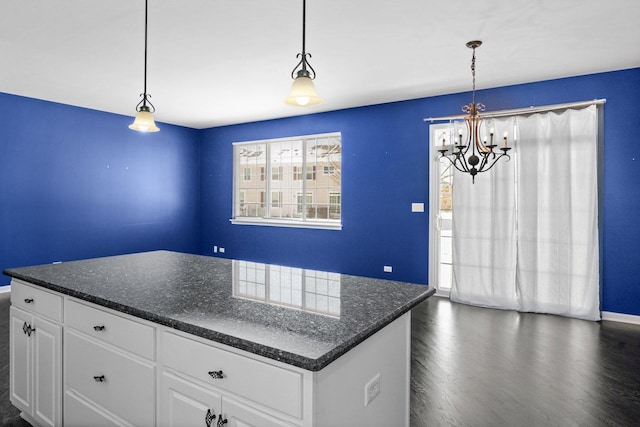 kitchen featuring pendant lighting, white cabinetry, and a wealth of natural light