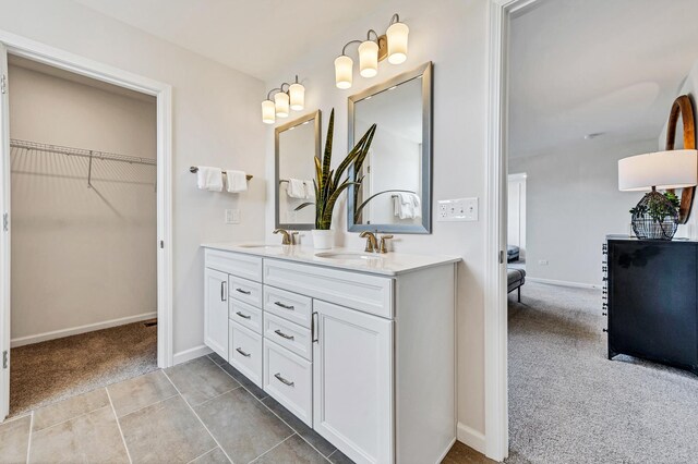 bathroom featuring tile patterned floors and vanity