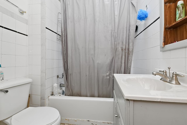 full bathroom with shower / bath combo, vanity, tile walls, and toilet