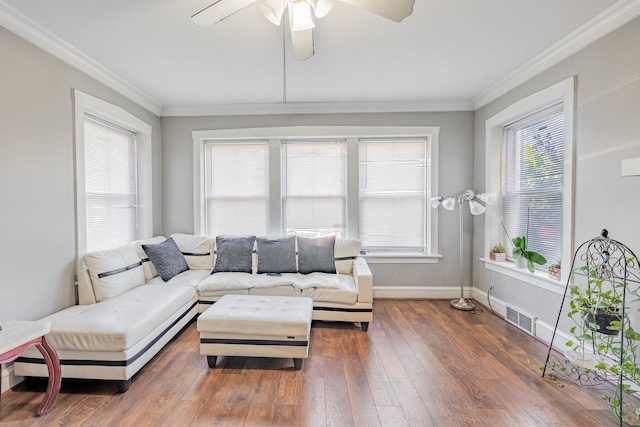 living room with dark wood-type flooring, ceiling fan, and ornamental molding