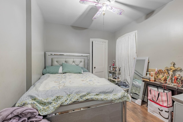 bedroom featuring ceiling fan and light hardwood / wood-style flooring