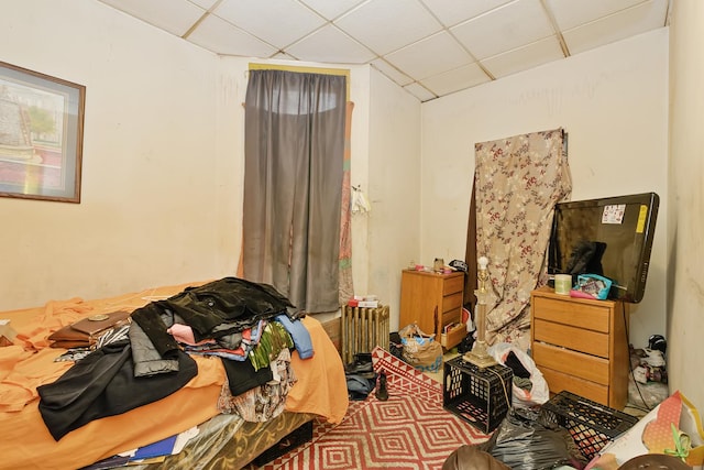 bedroom with a drop ceiling