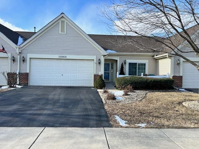 single story home featuring a garage