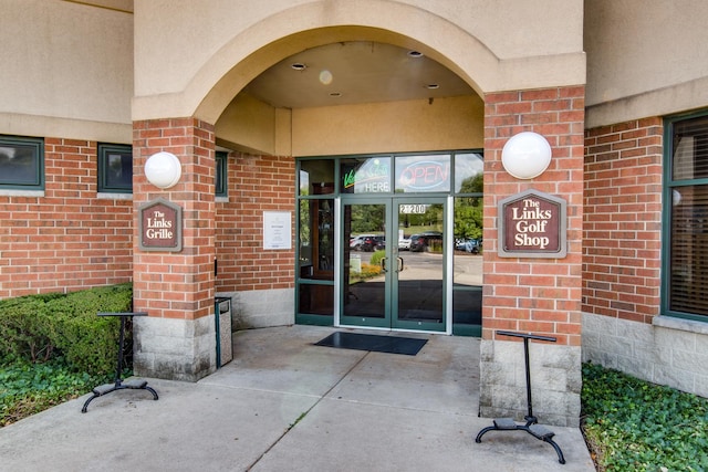 property entrance featuring french doors