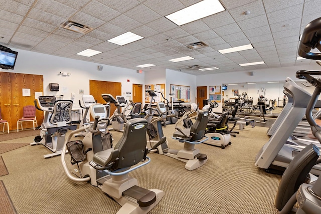 gym featuring a drop ceiling