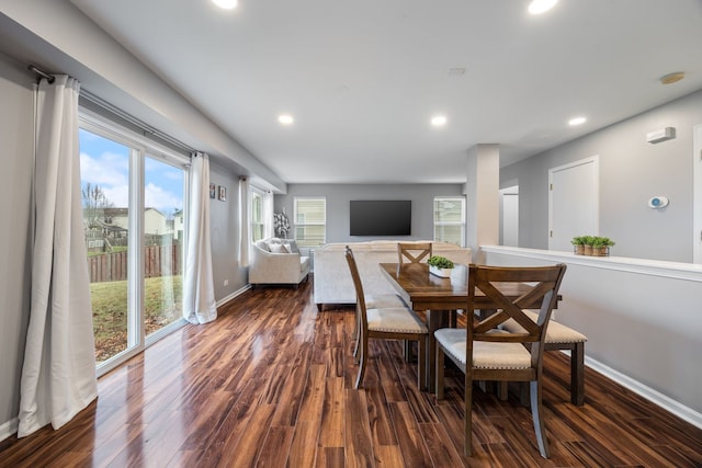 dining space featuring dark hardwood / wood-style flooring