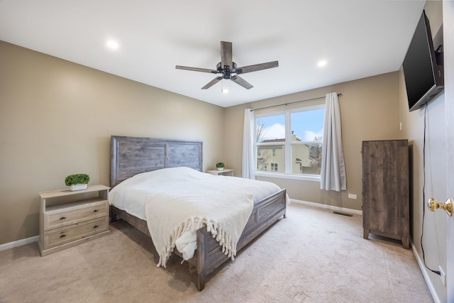 carpeted bedroom with ceiling fan