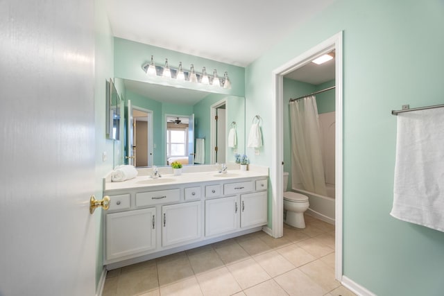 full bathroom with tile patterned flooring, vanity, toilet, and shower / bath combo with shower curtain