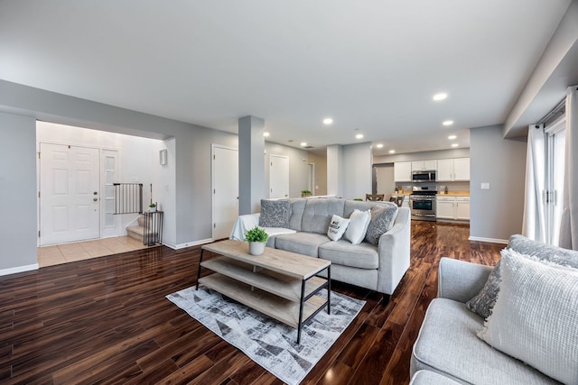 living room with dark hardwood / wood-style flooring