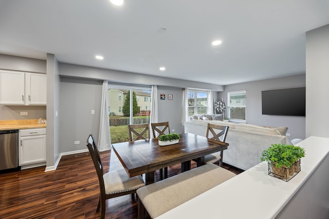 dining area featuring dark wood-type flooring