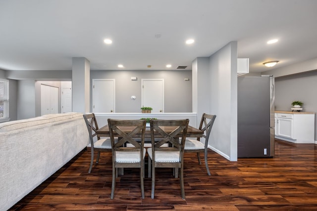 dining space featuring dark hardwood / wood-style flooring