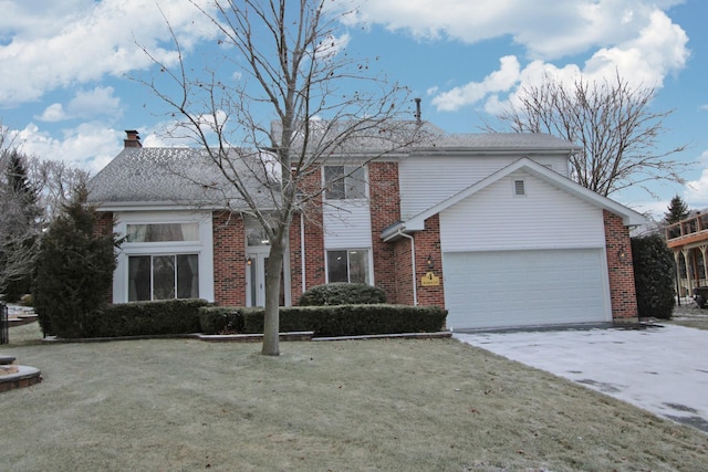 view of front property with a front yard and a garage