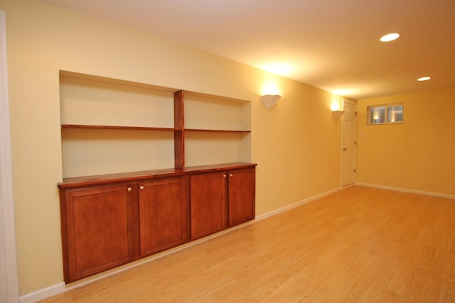 basement featuring light hardwood / wood-style floors